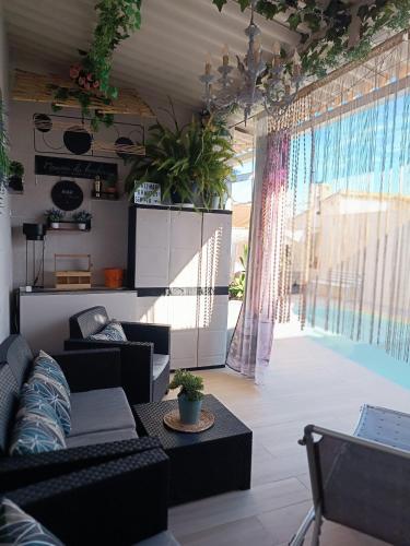 a living room with a couch and a table at Calymar in Sierra de Yeguas