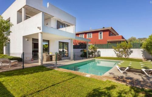 a house with a swimming pool in the yard at Oasis N'aguait in Cala Ratjada