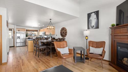 a kitchen and dining room with a table and chairs at Altitude Adjustment in Red Lodge