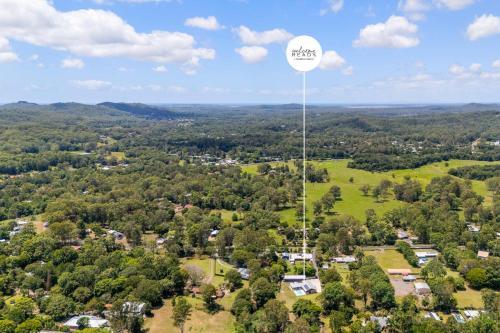 an aerial view of a town with a water tower at Hinterland Haven with Heated Pool & Lush Surrounds in Mooloolah