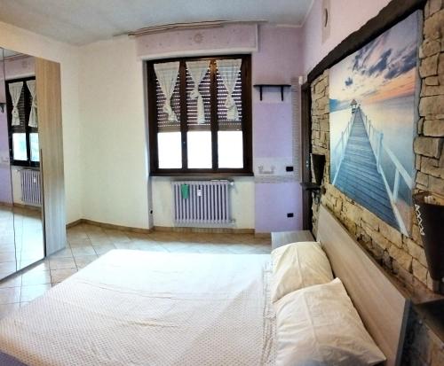 a living room with a couch and a window at Residence Future in Cologno Monzese