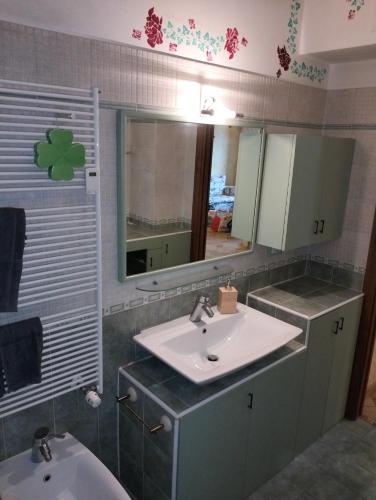 a bathroom with a sink and a mirror at Residence Future in Cologno Monzese