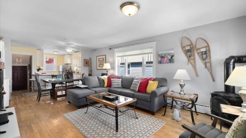 a living room with a couch and a table at Alpine Adventure in Red Lodge