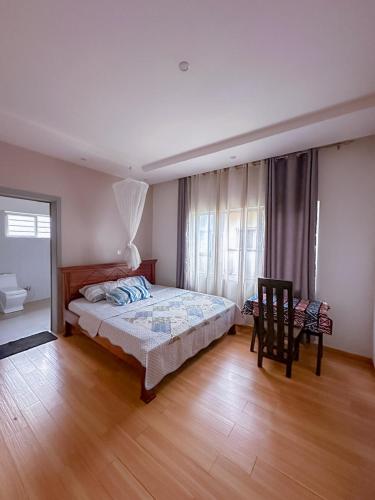 Llit o llits en una habitació de Positive House