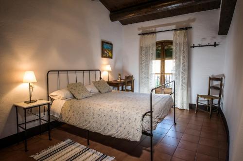 Postel nebo postele na pokoji v ubytování Casa Parramon