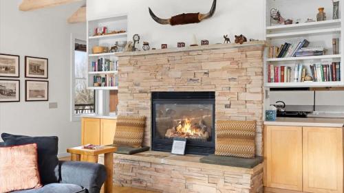 a fireplace in a living room with a fire place at Mountain Treetop in Red Lodge