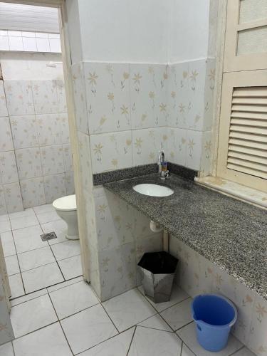 a bathroom with a sink and a toilet at Casa Nossa Senhora de Nazaré 2 in Belém