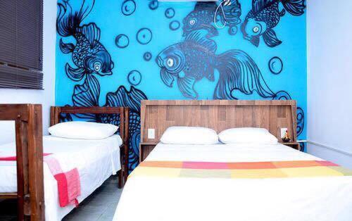 Ένα ή περισσότερα κρεβάτια σε δωμάτιο στο Mangueville
