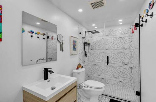 a bathroom with a shower and a toilet and a sink at The viewpoint in Marathon