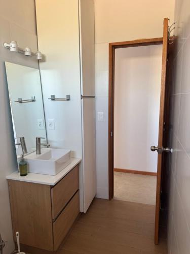 a bathroom with a sink and a mirror at Refugio del Indalo in Termas de Guaviyú