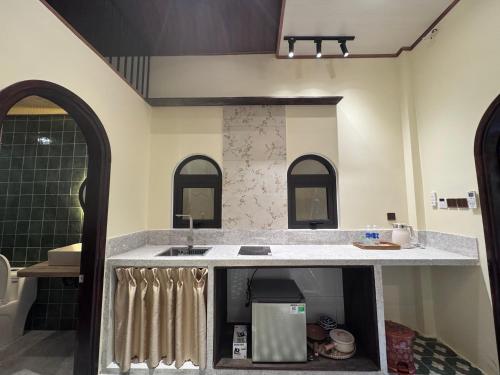 a bathroom with a sink and a counter top at The Hue Verandah in Thôn Trường Giang
