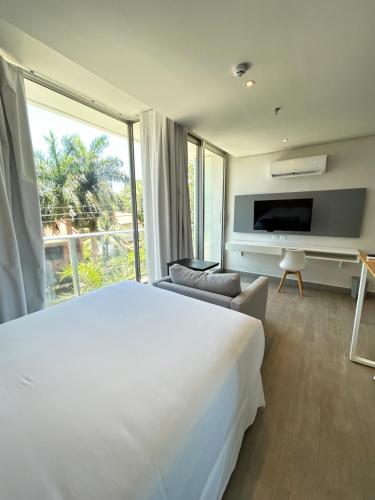 En eller flere senge i et værelse på Solara Hotel Boutique