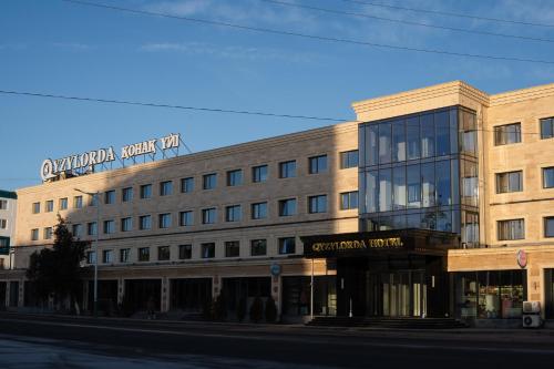 a rendering of a building on the corner of a street at Qyzylorda Hotel in Kyzylorda