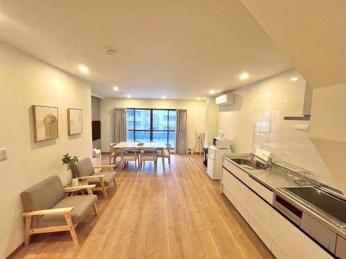 a kitchen and living room with a table and chairs at Skytree Luxury Villa - 2025 New, to Skytree, Direct Airport Access in Tokyo