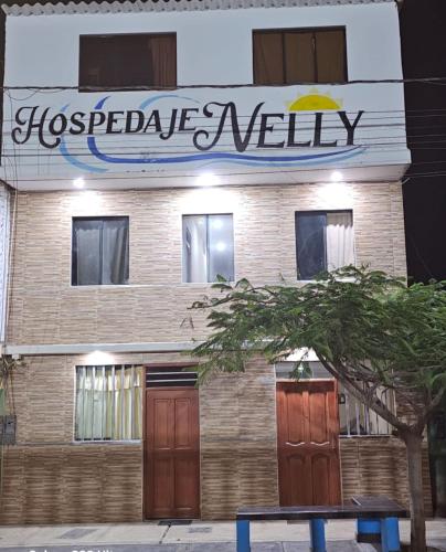 a building with a sign that reads hogbyte nelly at HOSPEDAJE NELLY in Puerto Chicama