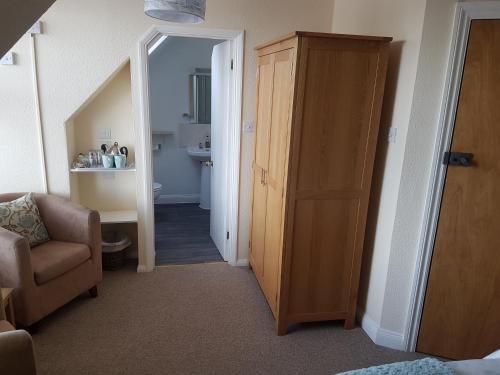 a hallway with a door leading to a bathroom at The Trelinda Guest House in Newquay