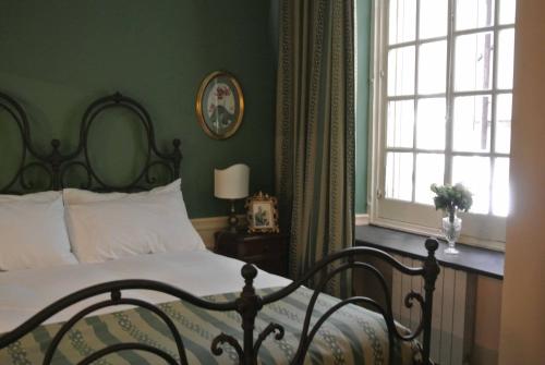 Postel nebo postele na pokoji v ubytování Palazzo Zecchino B&B