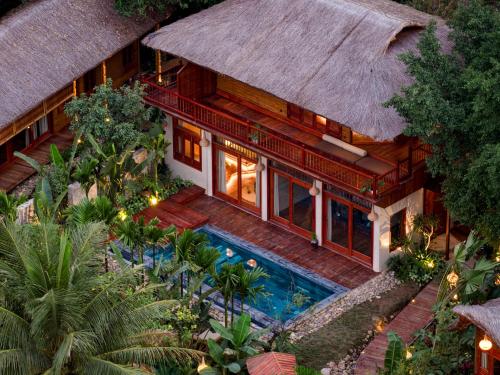 an aerial view of a house with a swimming pool at Lamia Bamboo Retreat Ninh Binh in Ninh Binh