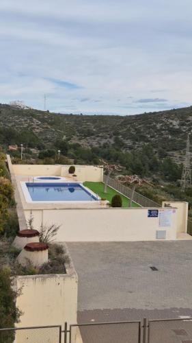 Adosado familiar 160 m, 2 piscinas, vistas al mar y montaña, 7 personas, wifi, mascotas, cuna