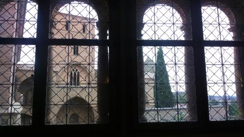 a view through a stained glass window of a building at Parador de Alcañiz in Alcañiz