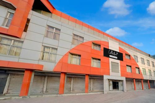 an orange and white building with a sign on it at Collection O Ayodhya Ring Road Bhopal in Bhopal