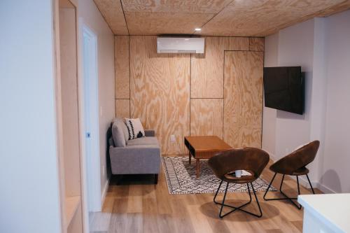 a living room with a couch and a table and chairs at Outbounder in Bayfield
