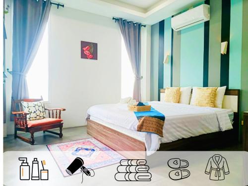 a bedroom with a bed and a chair and a window at Villa Rajapruek 3 Villa Estates For A Private Group and Daily Maid in Chiang Mai