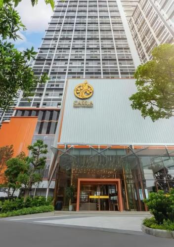 a building with a face on the front of it at Cassia Residence Rama 9 Bangkok in Bangkok