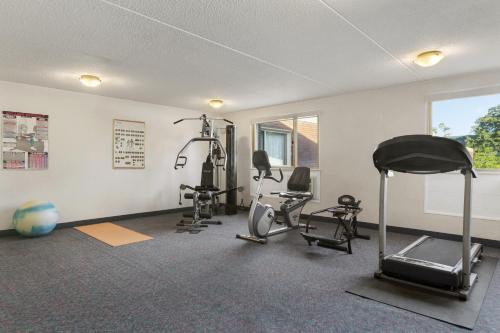 a gym with several exercise equipment in a room at Days Inn by Wyndham Bridgewater Conference Center in Bridgewater