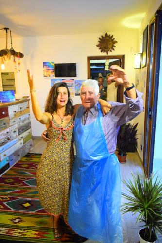 a man and a woman posing for a picture at Timbuktu Hostel in San Vito lo Capo
