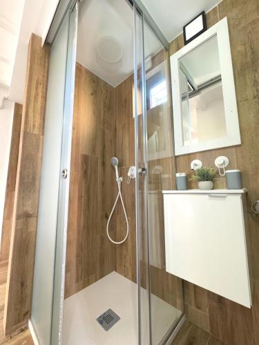 a shower stall with a glass door in a bathroom at Godello - Harbor's Light in Villajoyosa