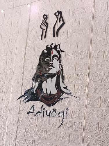 a sign on a wall with a monkey on it at Blue Sapphire in Hinjewadi