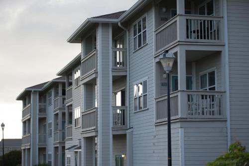 a row of apartment buildings with balconies and a street light at Atlantic Beach Resort, a Ramada by Wyndham in Atlantic Beach