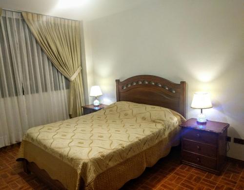 Säng eller sängar i ett rum på Apartamentos Sercan