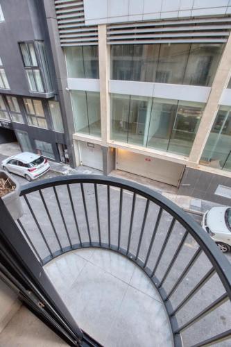 a spiral staircase in the middle of a building at 1-Bed Suite Near Spinola Bay in Paceville