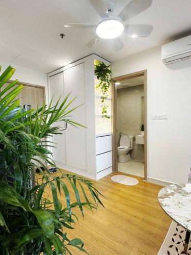 an empty room with a toilet and plants in it at Studio Ocean Park 0301 - toà S1 in Gia Lâm Pho