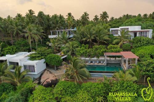 an aerial view of a resort with a swimming pool at Rumassala Villas in Unawatuna