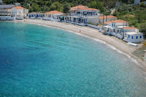 an aerial view of a beach with white houses at Agali Beach Apartments Seaside Stay in Chios in Mármaron