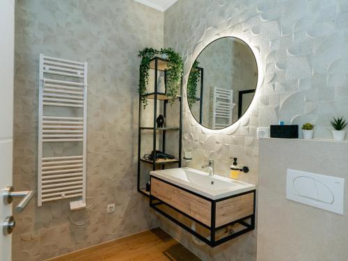 a bathroom with a sink and a mirror at ToRo Hospitality in Mostar