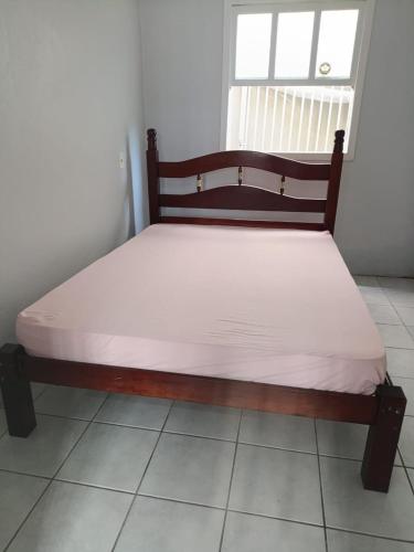 a bed in a room with a white mattress at Casa Laguna in Laguna