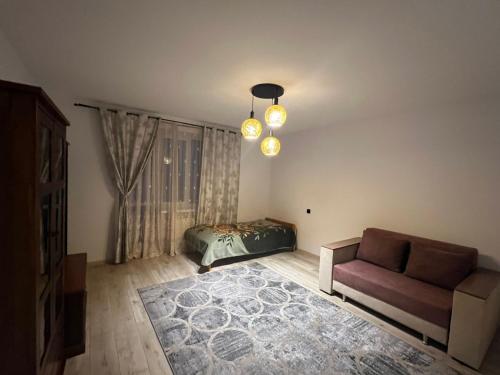 a living room with a couch and a window at Апартаменти біля АС-1 Зацепи in Lutsk