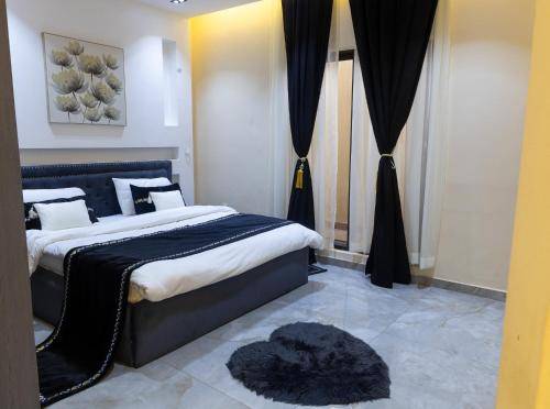 เตียงในห้องที่ Résidence heinda
