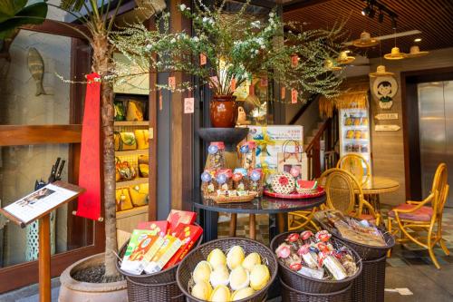 a store with baskets of food on a table at Riverside Seahorse Danang Hotel in Danang