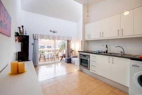One-bedroom Apartment With Terrace, Pool and Partial Sea Views