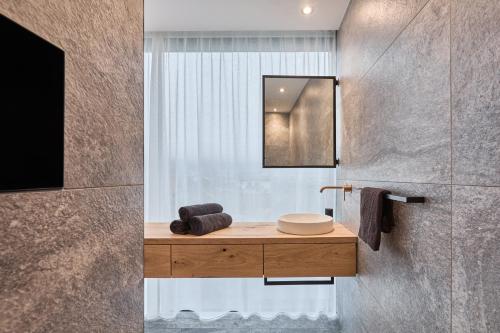 a bathroom with a sink and a mirror at Gapphof in Lagundo