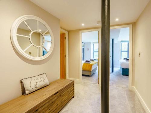 a room with a bench and a mirror at 2 Bed in Keighley oc-83162 in Cononley