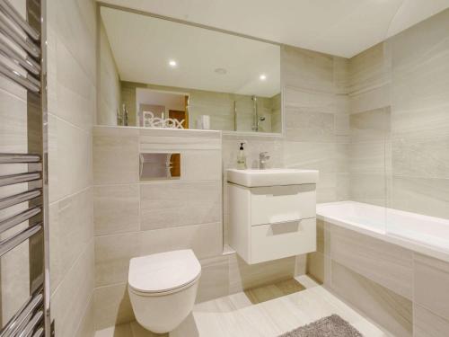 a bathroom with a toilet and a sink and a tub at 2 Bed in Keighley oc-83162 in Cononley