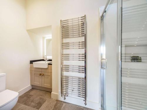 a bathroom with a shower and a toilet and a sink at 2 Bed in Mindrum oc-86637 in Carham