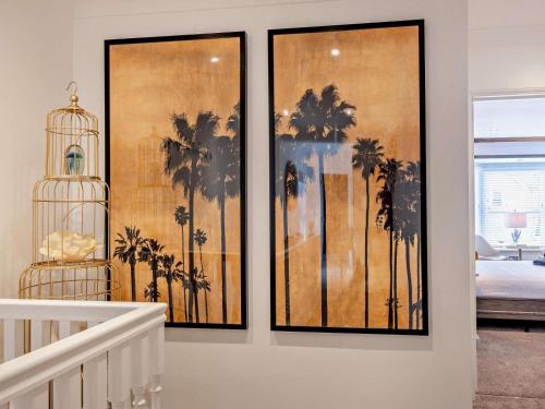 three framed pictures of palm trees on a wall at 3 Bed in Shanklin oc-92053 in Shanklin