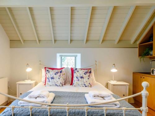 a bedroom with a bed with towels on it at 2 Bed in Scarborough oc-82543 in Snainton